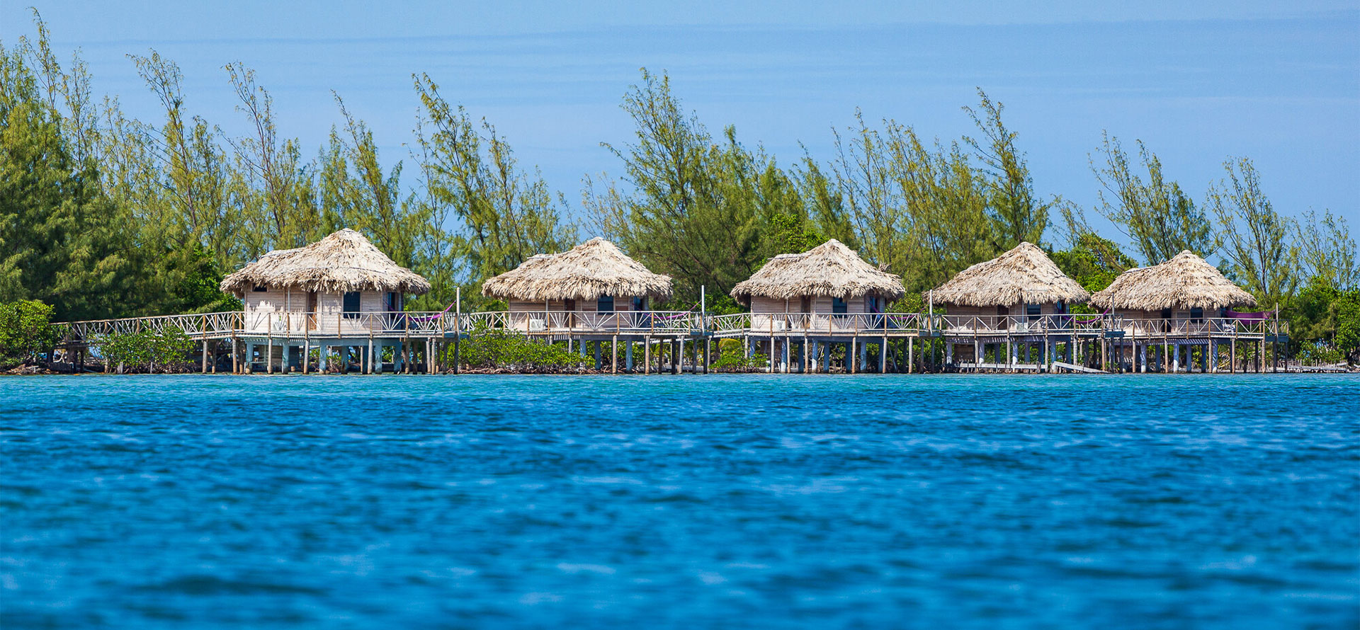 Belize overwater bungalows in ocean.