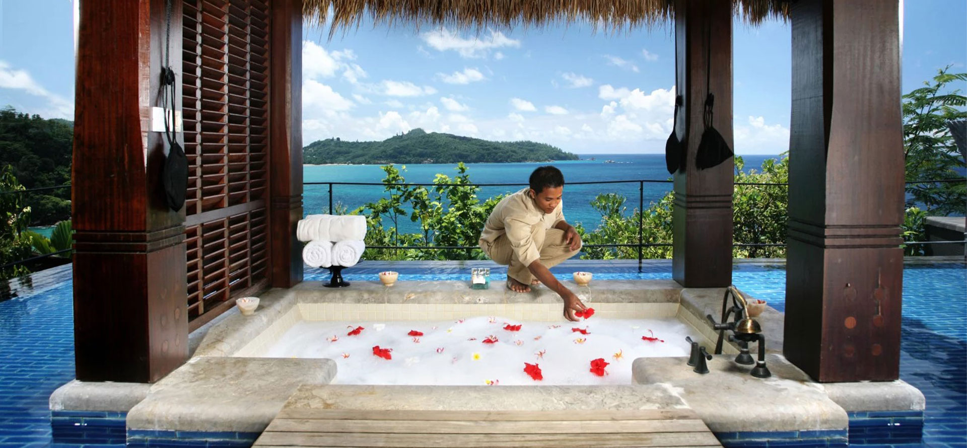 Seychelles all inclusive resort bath with flowers.