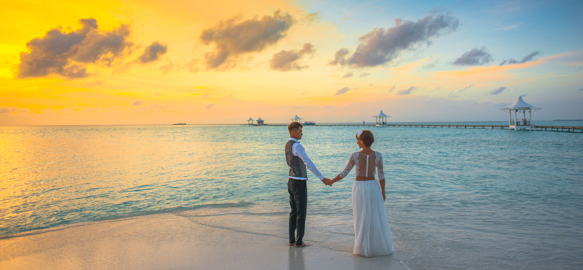 Lovers on the beach Bora Bora honeymoon.