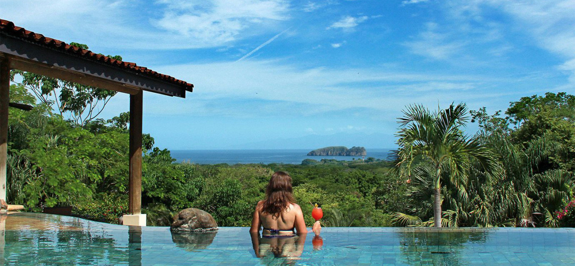 Costa rica all-inclusive adults only resort and woman with coctail.