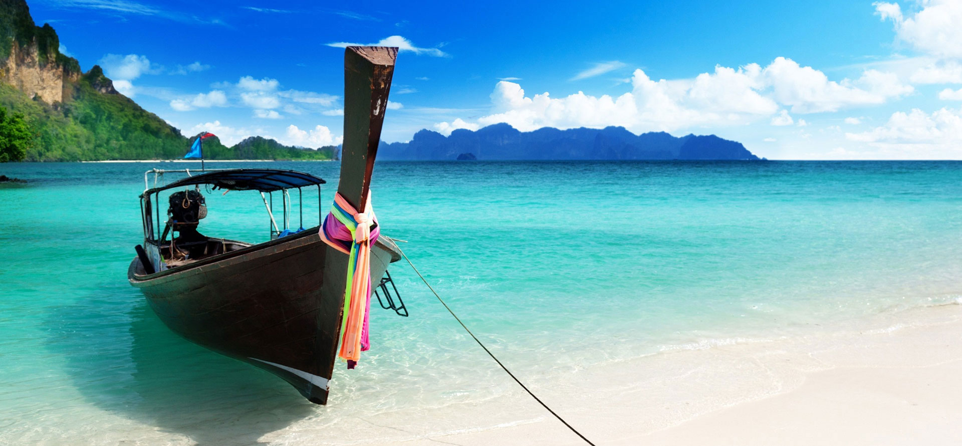 Hawaii vs cancun boat at the beach.