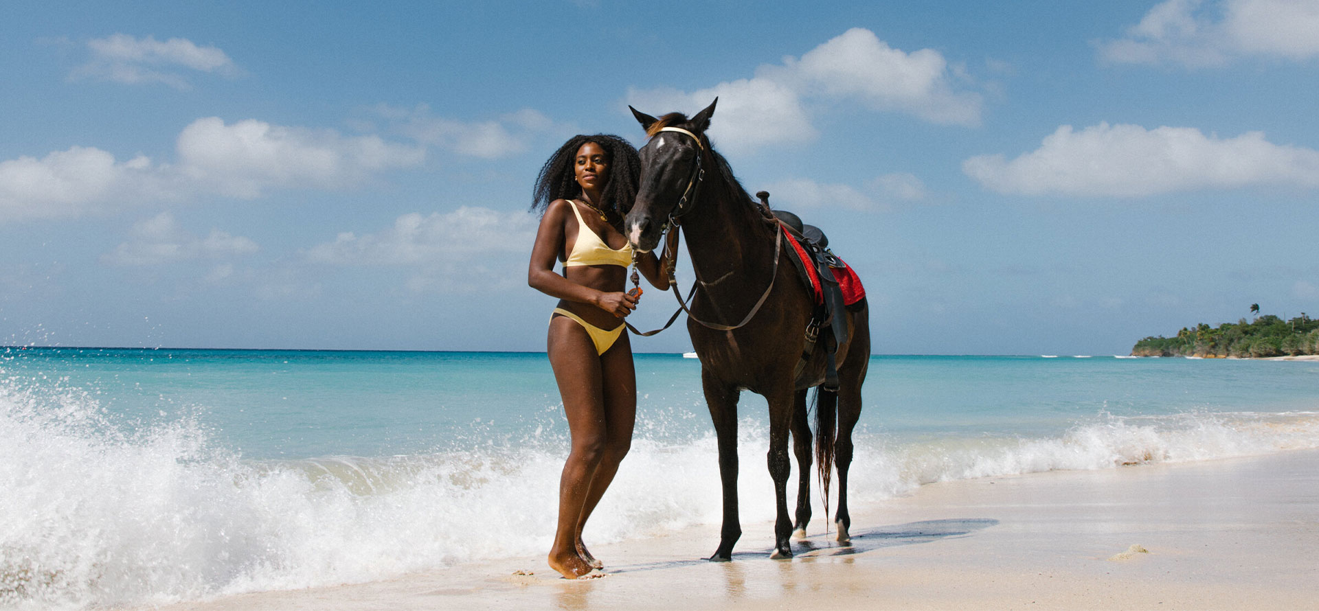 St. Croix honeymoon woman and horse at the beach.