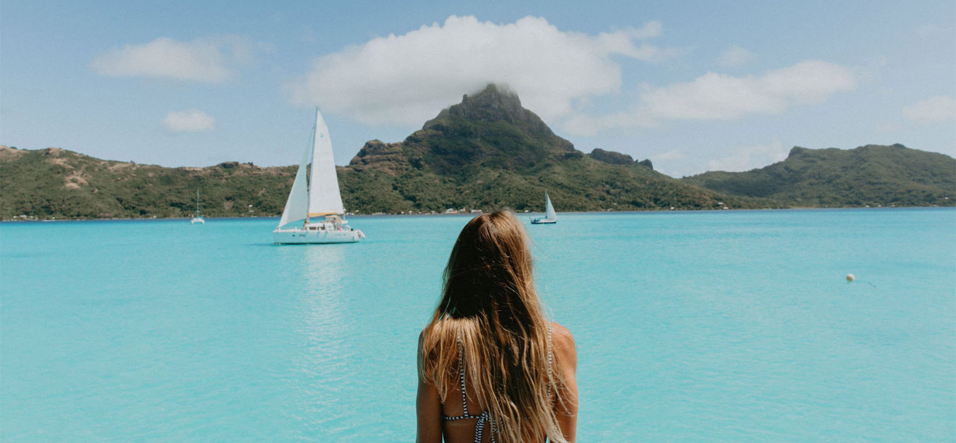 Woman in swimming pool at Tahiti honeymoon.