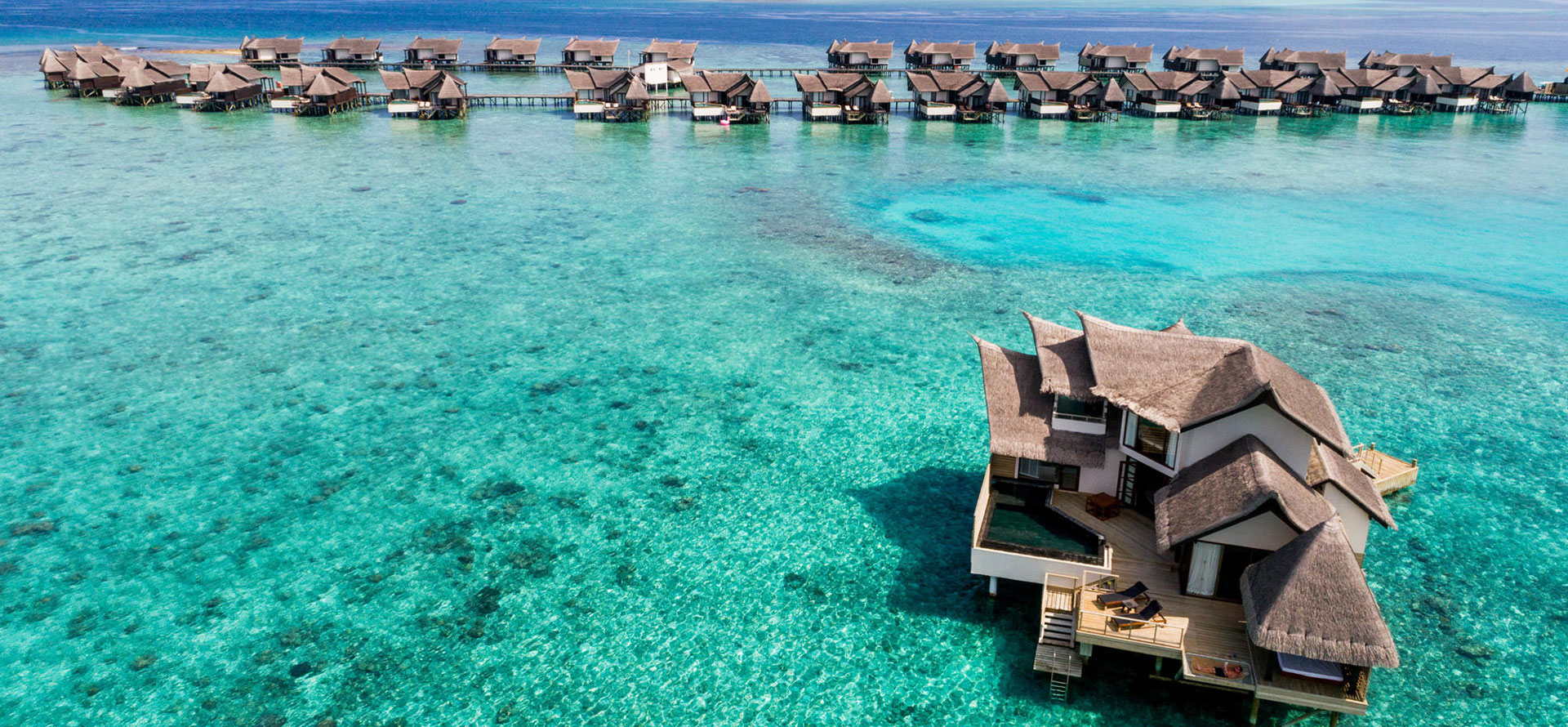 Top view maldives bungalow on water.