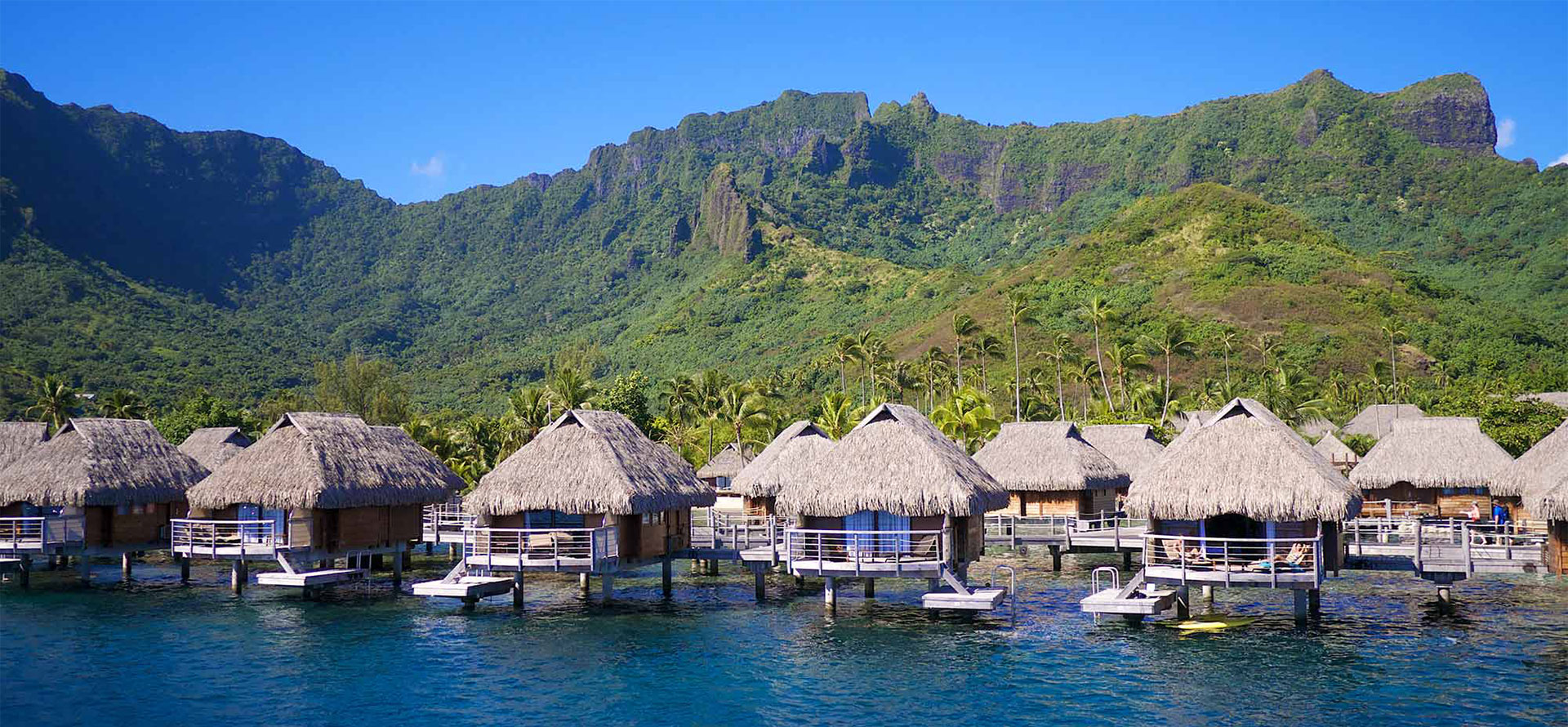 Beautiful view Moorea overwater bungalows and mountains.