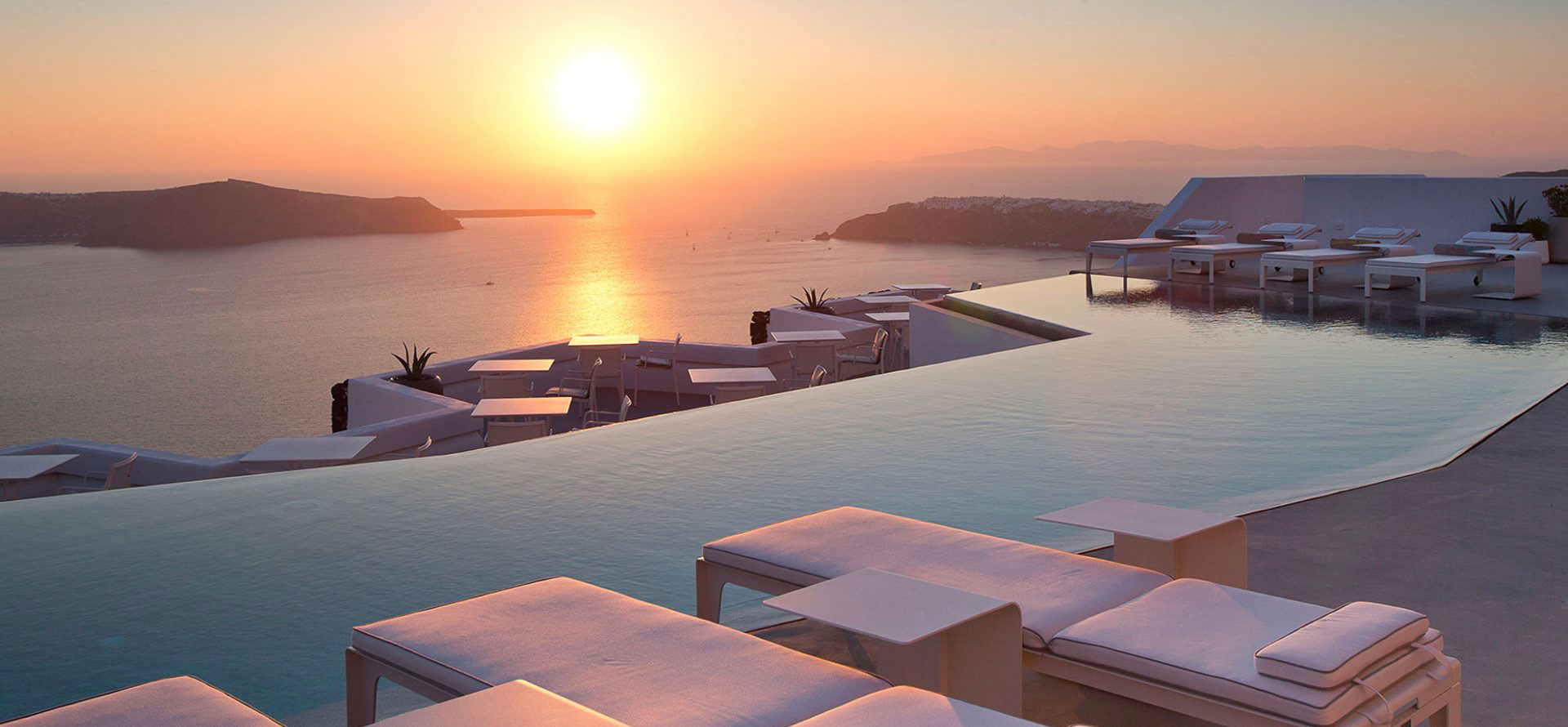 Santorini greece all inclusive resort and sunset.