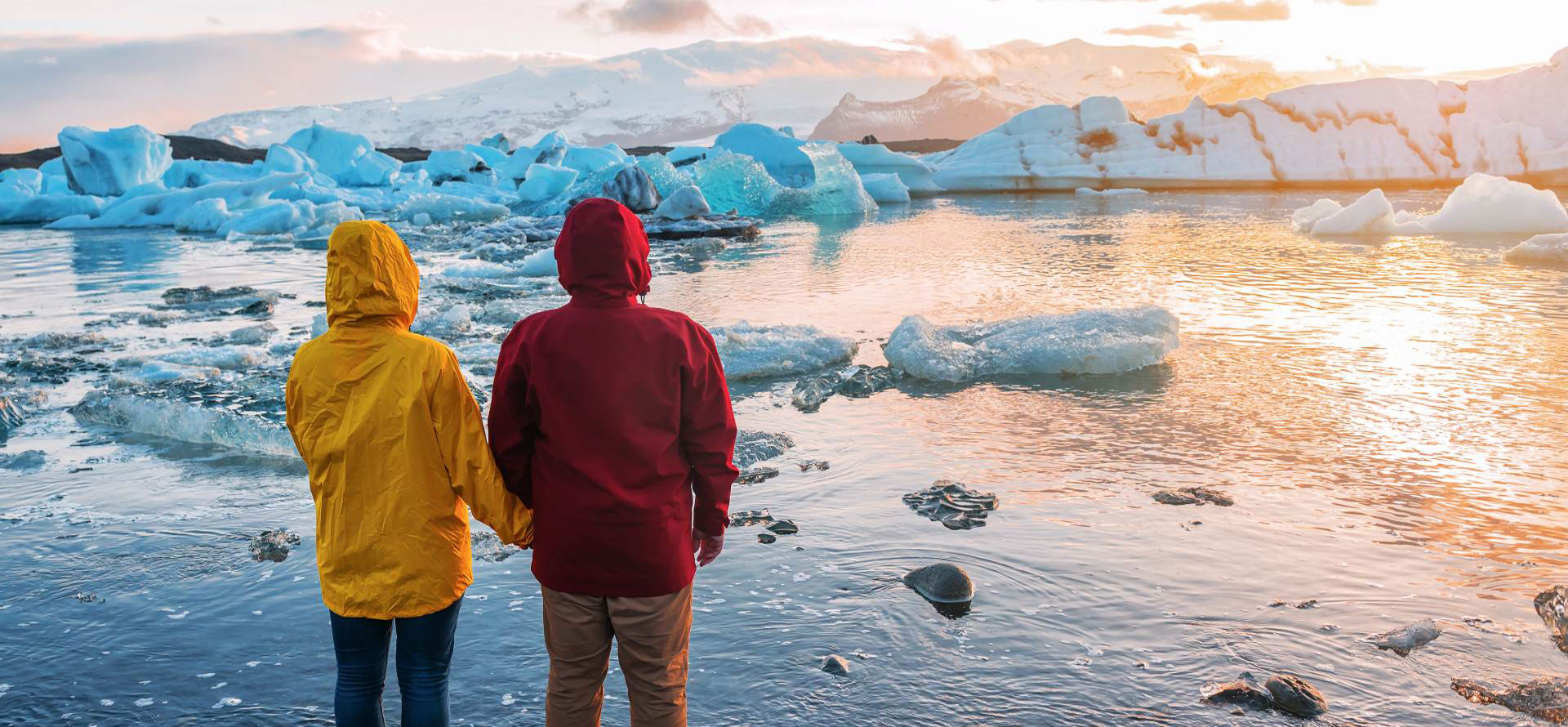 Couple and glacier in Iceland.