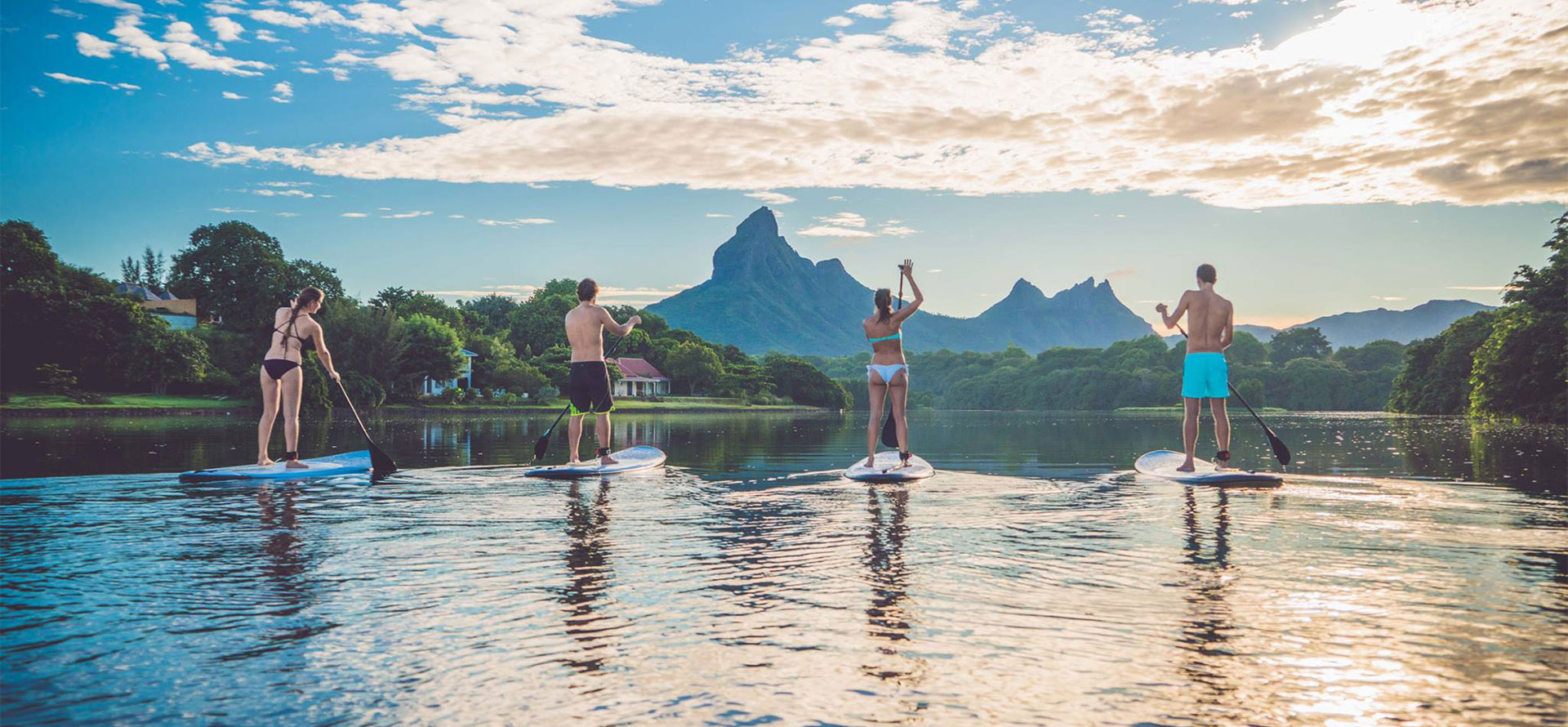 Swimming on paddle boards in Mauritius.
