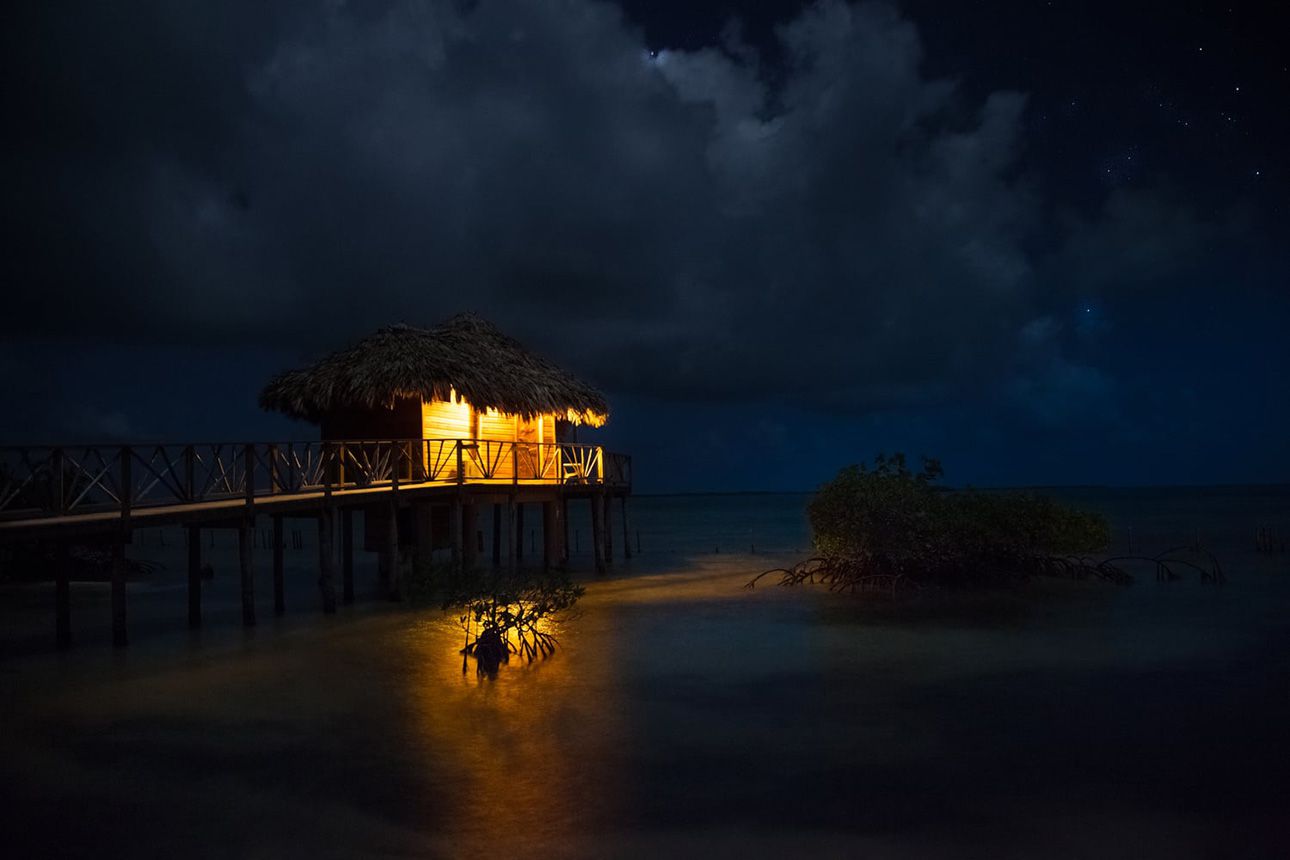 Premier Overwater Bungalows - at night.