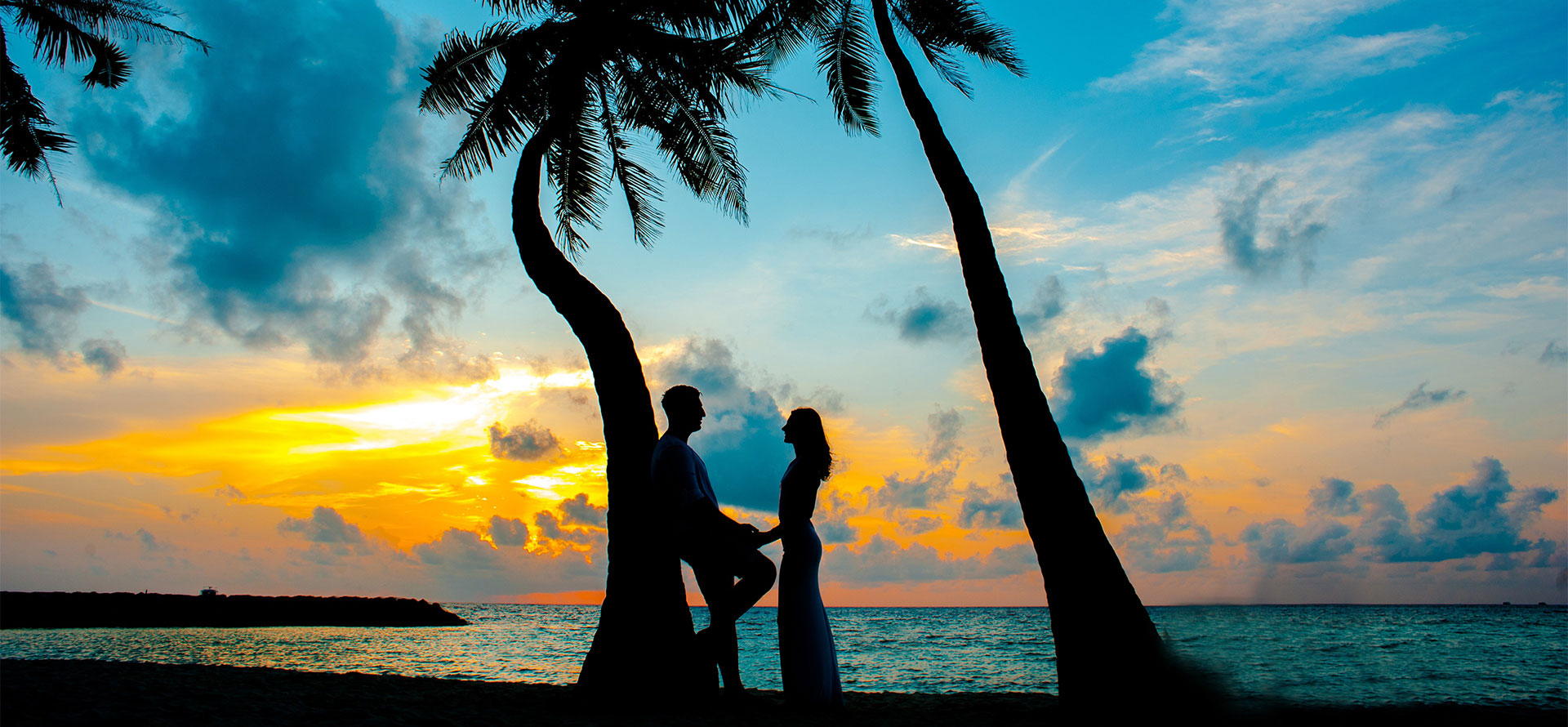 Newlyweds on Fiji beach on honeymoon.